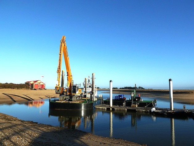 Photo of the lifeboat house and inner harbour at Wells-next-the-sea.