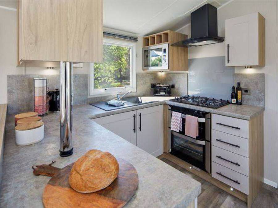 Picture of the kitchen in a Willerby Manor 38 x 12 2 bedroom Static Caravan Holiday Home, sited at The Orchard Holiday Park, Wells next the Sea, North Norfolk.