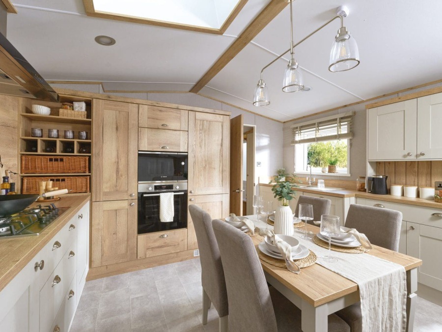 Picture of the kitchen and dining table in a ABI Ambleside 40 x 13 2 bedroom Static Holiday Caravan sited at Friary Farm Caravan Park, Blakeney, North Norfolk.