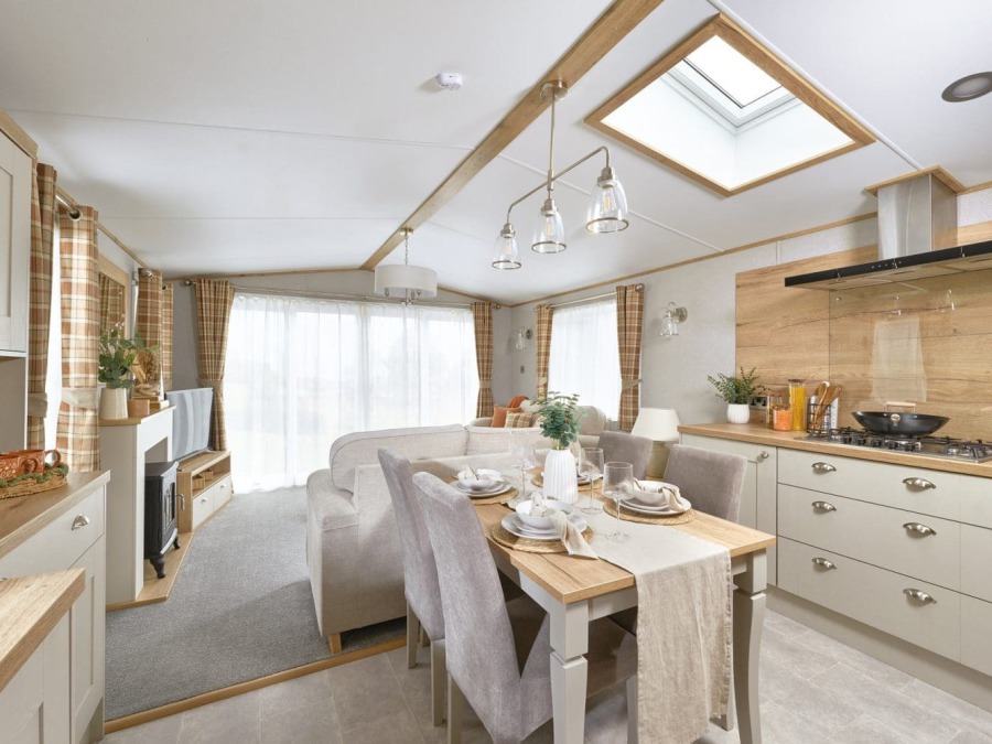 Picture of the kitchen and dining table in a ABI Ambleside 40 x 13 2 bedroom Static Holiday Caravan sited at Friary Farm Caravan Park, Blakeney, North Norfolk.