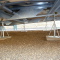 Poto of connections and blocks on the underside of a static caravan