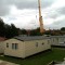 Picture of a caravan being lifted by a crane at Orchard Holiday Park, Wells-next-the-sea, Norfolk