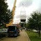 Picture of a caravan being lifted by a crane at Orchard Holiday Park, Wells-next-the-sea, Norfolk
