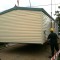 Picture of a caravan being lifted by a crane at Orchard Holiday Park, Wells-next-the-sea, Norfolk