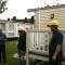 Picture of a caravan being lifted by a crane at Orchard Holiday Park, Wells-next-the-sea, Norfolk
