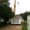 Picture of a caravan being lifted by a crane at Orchard Holiday Park, Wells-next-the-sea, Norfolk