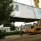 Picture of a caravan being lifted by a crane at Orchard Holiday Park, Wells-next-the-sea, Norfolk