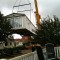 Picture of a caravan being lifted by a crane at Orchard Holiday Park, Wells-next-the-sea, Norfolk