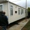 Picture of a caravan being lifted by a crane at Orchard Holiday Park, Wells-next-the-sea, Norfolk